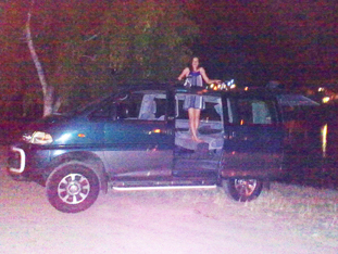 Somar standing up inside through sun roof